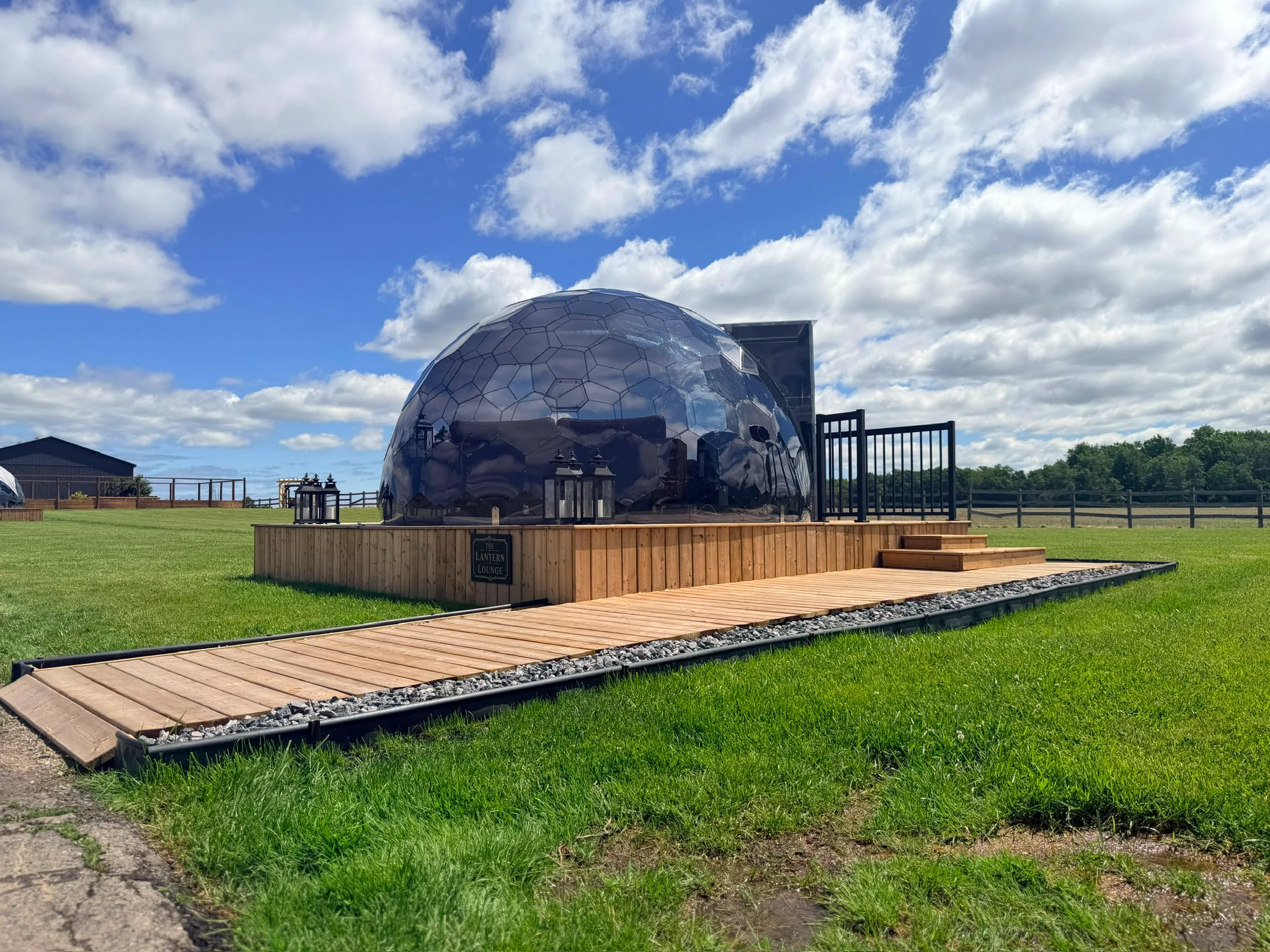 The Reflection Dome on its deck under a blue sky